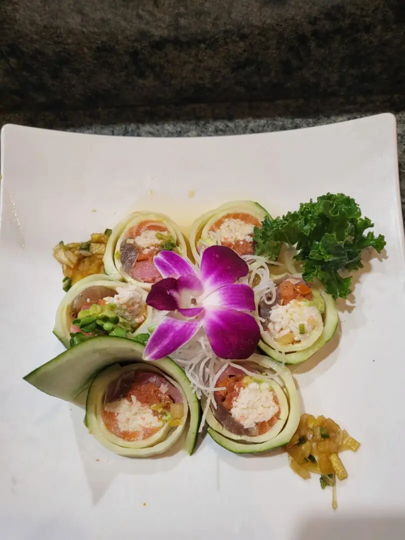 A plate of food with some flowers on it